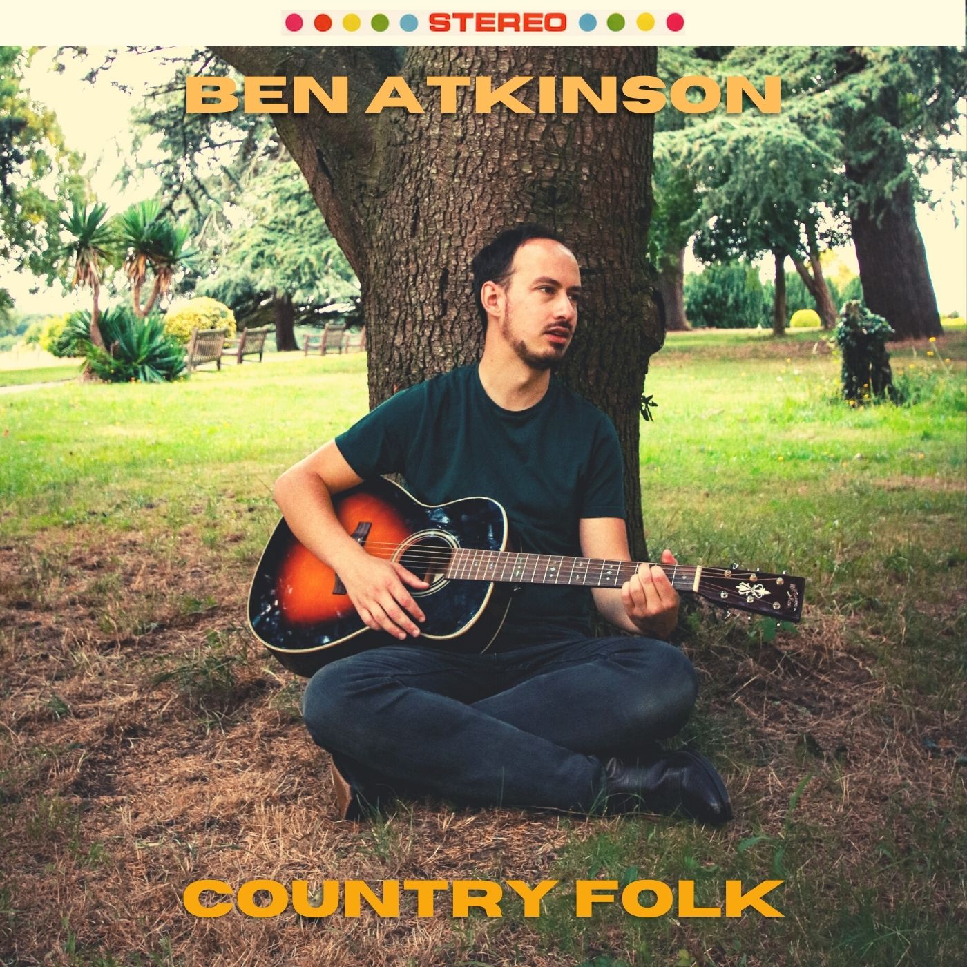 Ben sitting under a tree at Wollaton Hall image used for the cover of the album Country Folk